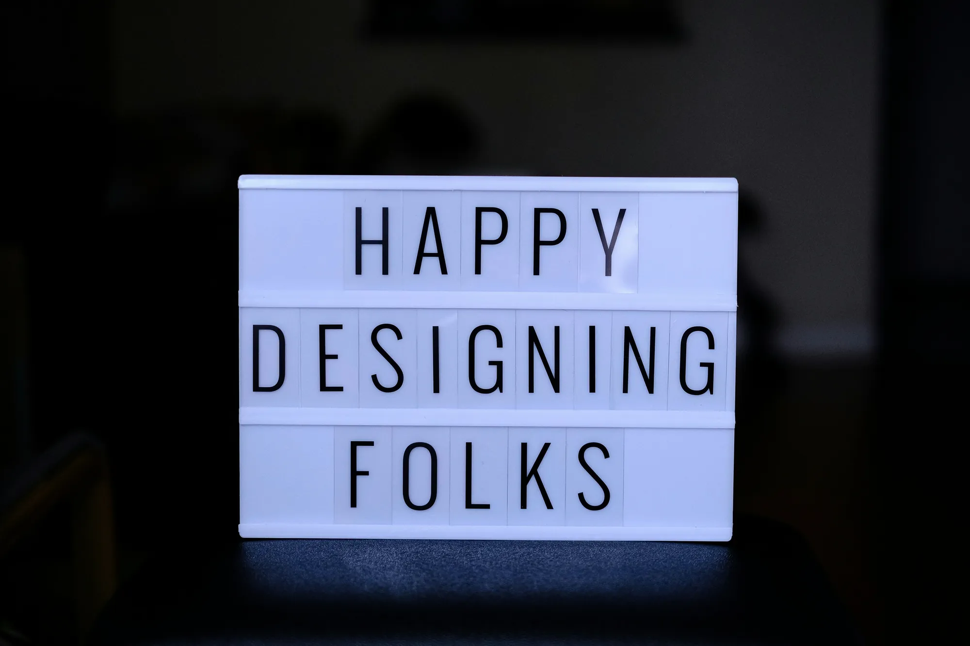 Lightbox sign reading Happy designing folks